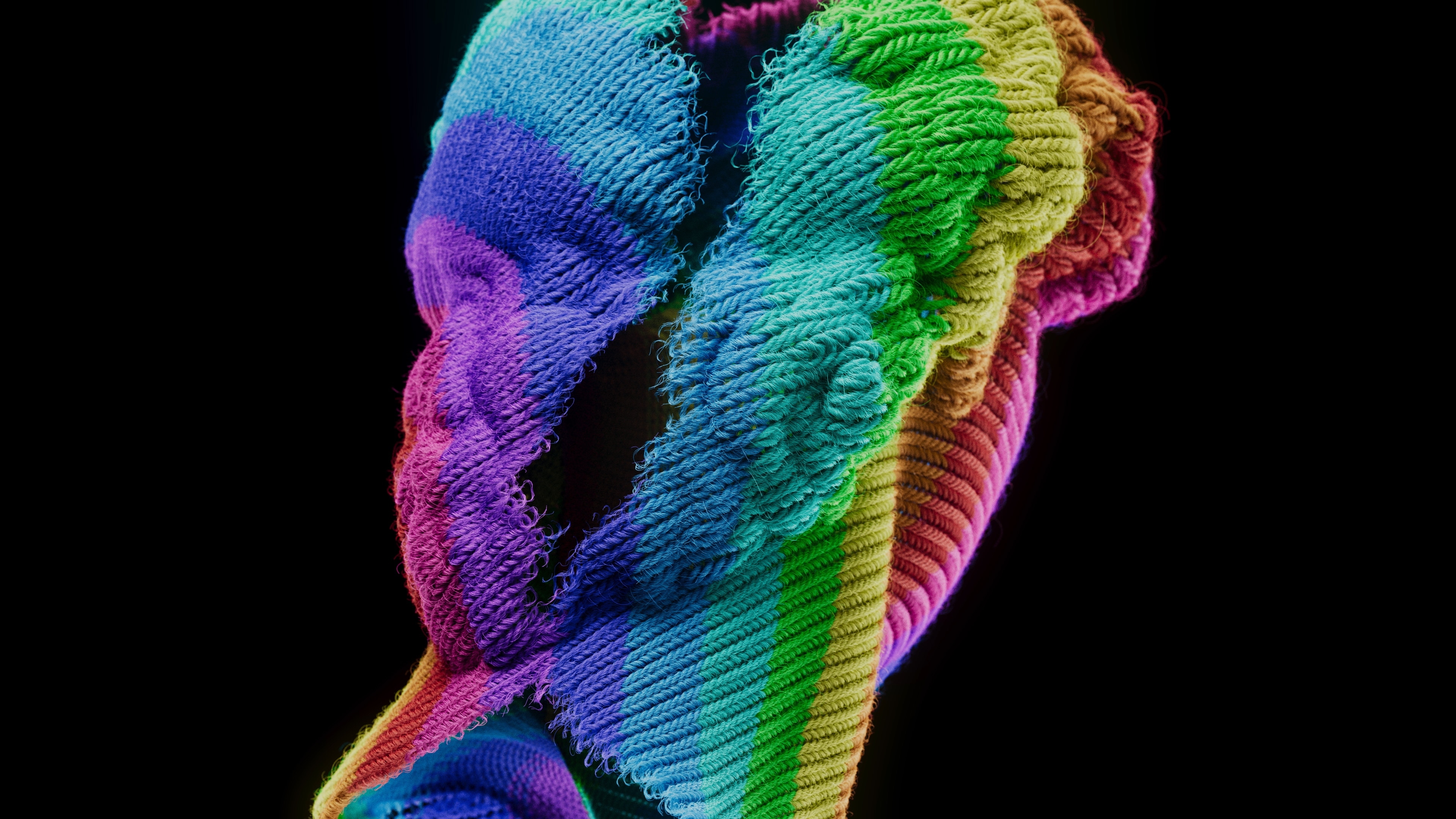Low-angle view of the rainbow-striped knitted head from behind, showing curled hair and ribbed stitches down the neck