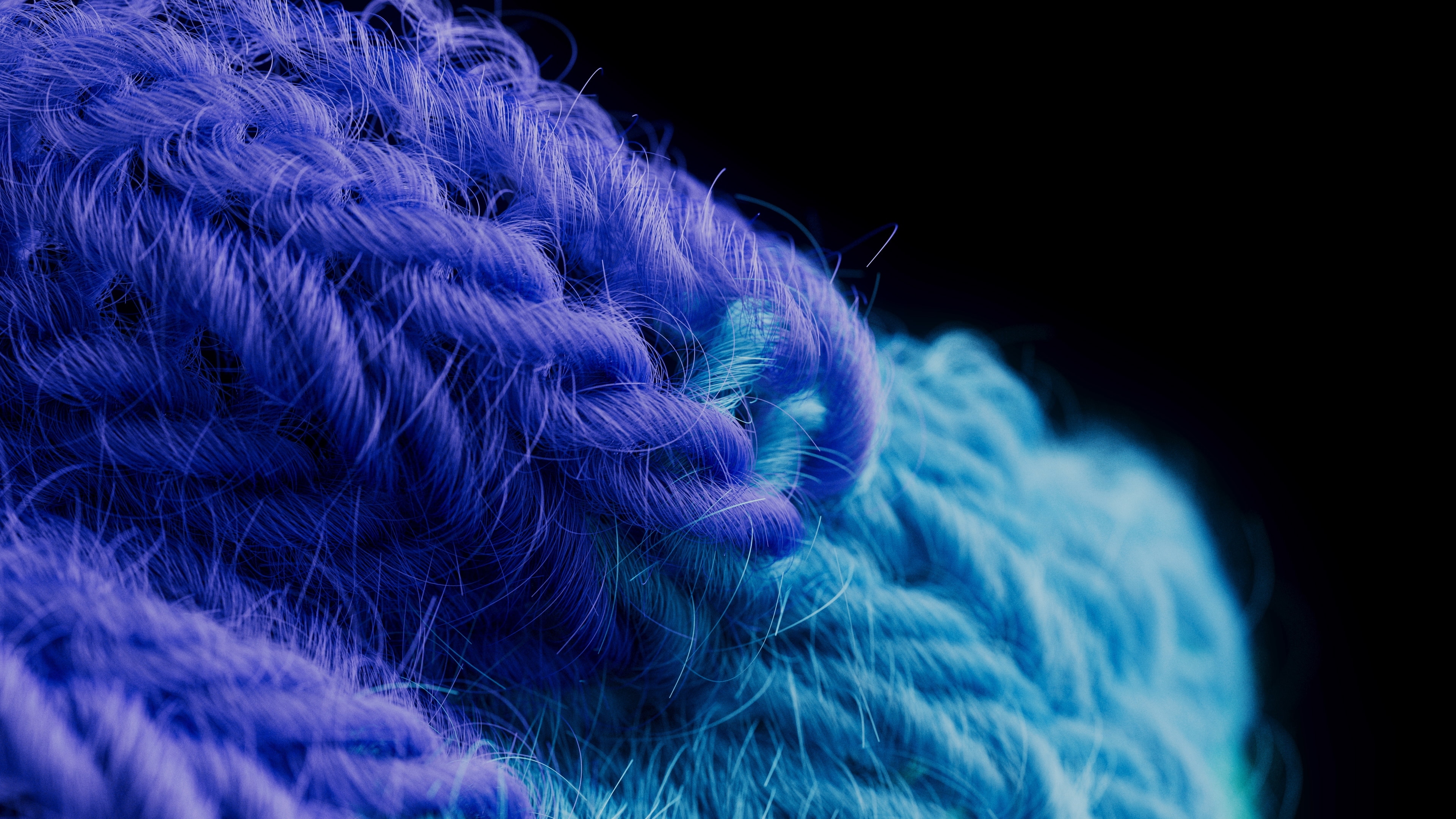 Macro render of purple knitted stitches with fine stray fibers meeting a band of pale blue knit, lit against black